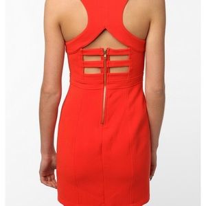 Coral bodycon dress with cutouts
